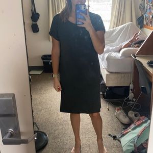 A dark grey, knee length dress, size small.
